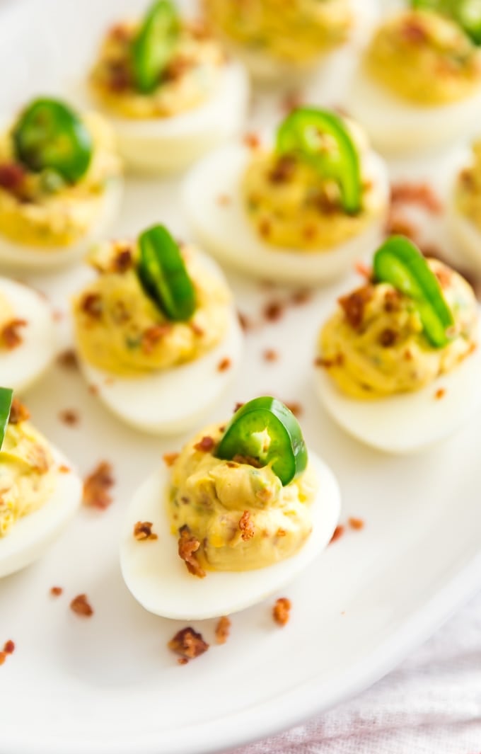 The edge of a plate of Jalapeno Popper Deviled Eggs.