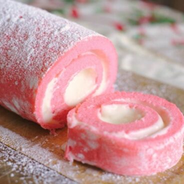 A close up of a pink cake roll