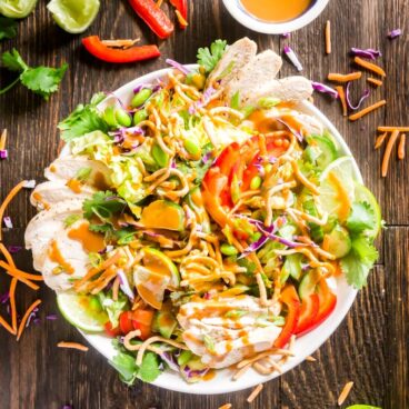 Asian Salad with Peanut Dressing is crisp, refreshing and full of delicious flavors- this is the perfect healthy main dish but can also be made to feel a crowd as a side dish or starter that will have people fighting for seconds!