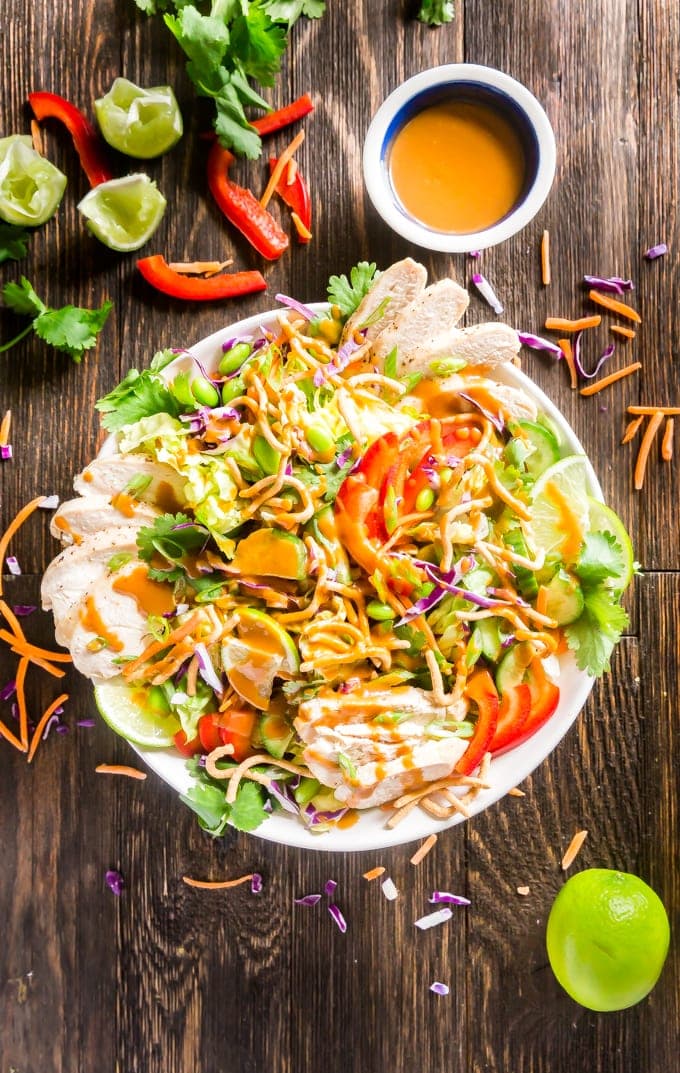 Asian Salad with Peanut Dressing is crisp, refreshing and full of delicious flavors- this is the perfect healthy main dish but can also be made to feel a crowd as a side dish or starter that will have people fighting for seconds!