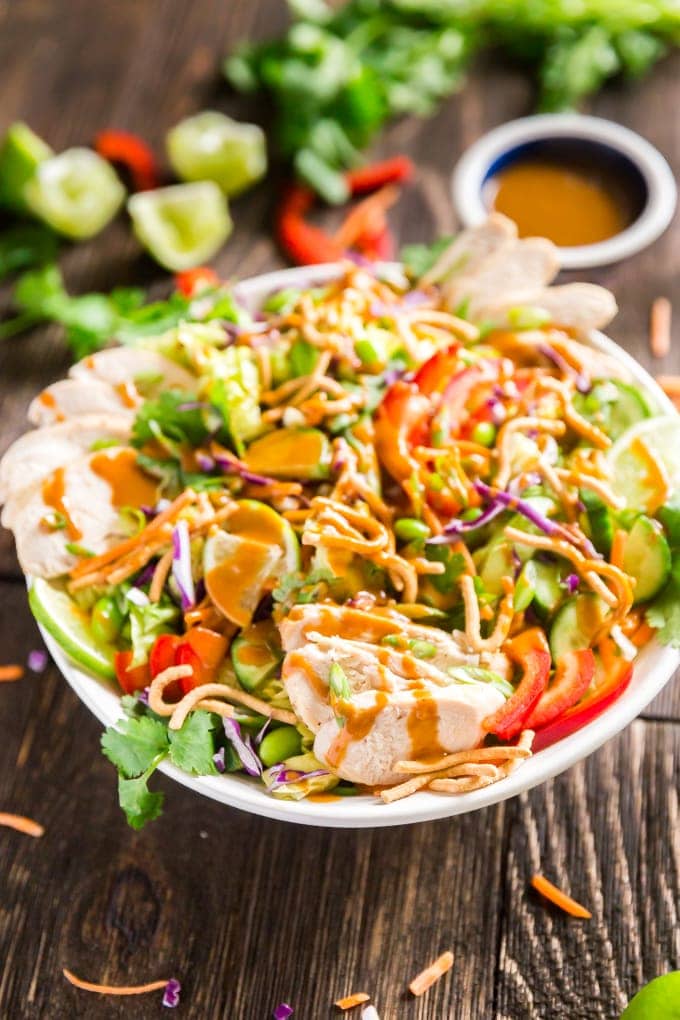 Asian Salad with Peanut Dressing is crisp, refreshing and full of delicious flavors- this is the perfect healthy main dish but can also be made to feel a crowd as a side dish or starter that will have people fighting for seconds!