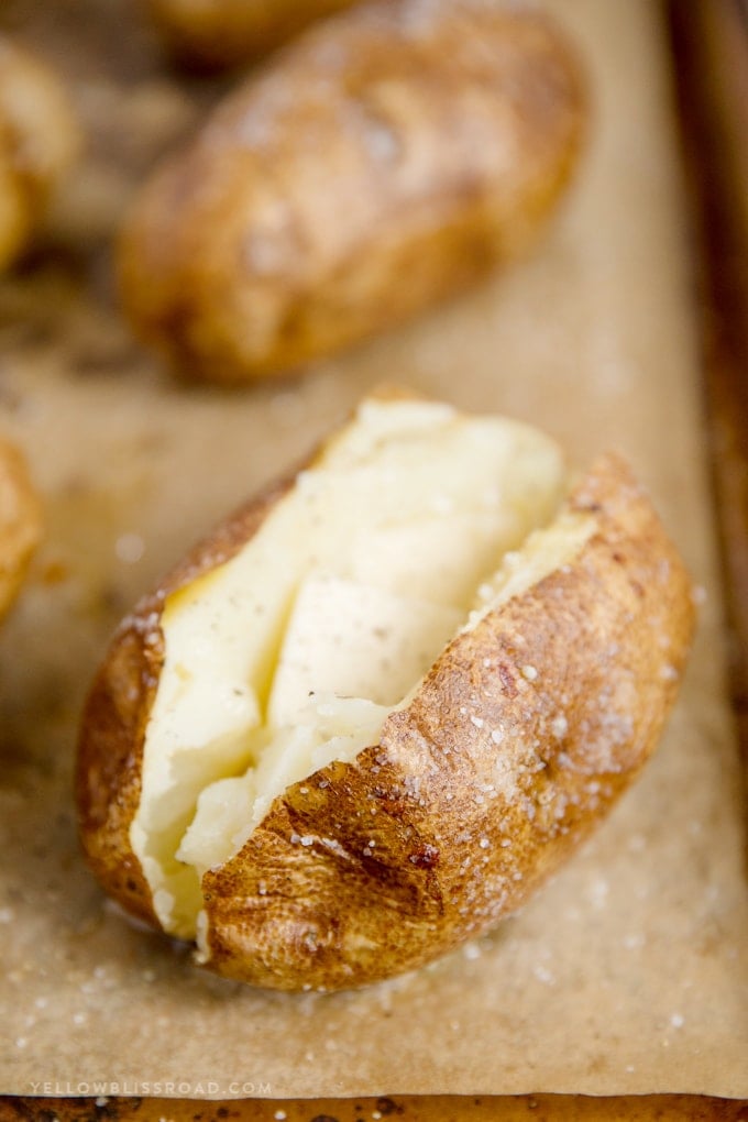 Baked potato with melted butter and salt