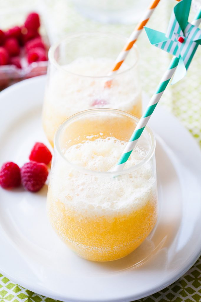 A close up of a glass of banana pineapple punch