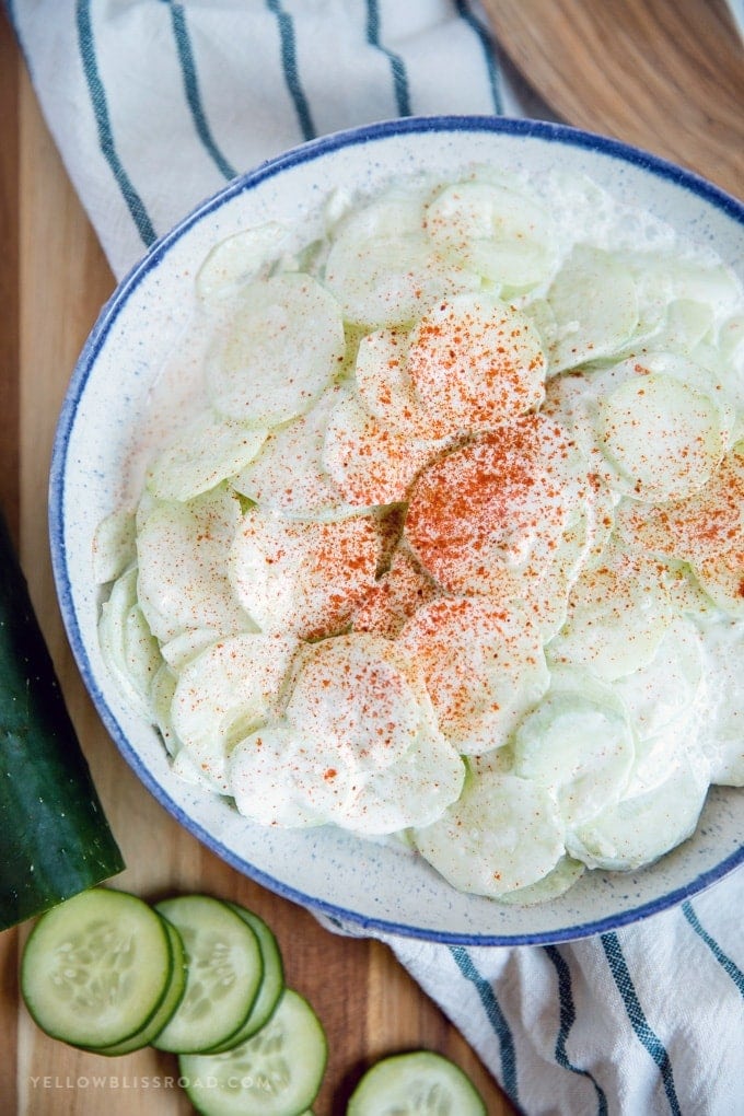 Creamy Cucumber Salad (Gurkensalat) - full of crisp cucumbers, tangy vinegar and spicy garlic, all coated in smooth sour cream sauce. A refreshing side dish for spring and summer.