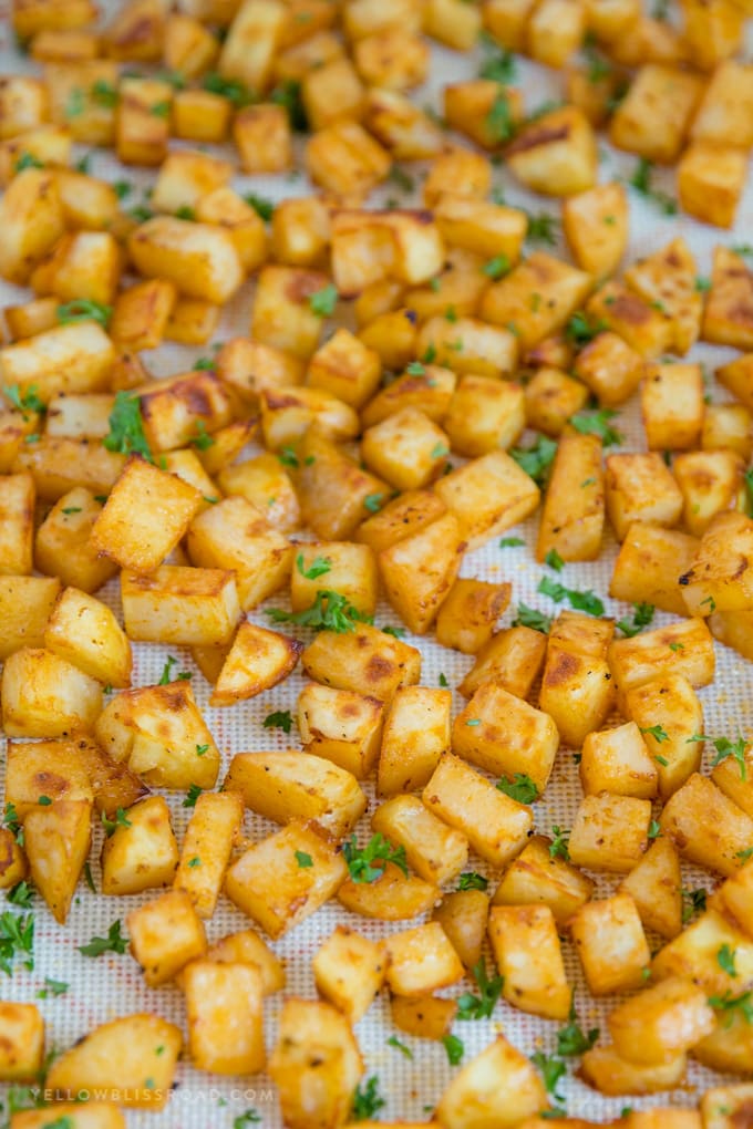 diced potatoes and parsley on a silicone mat