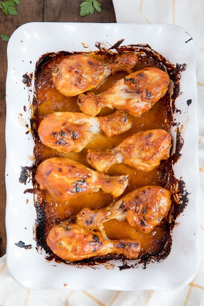 Baked Chicken Drumsticks with honey mustard sauce in a baking dish