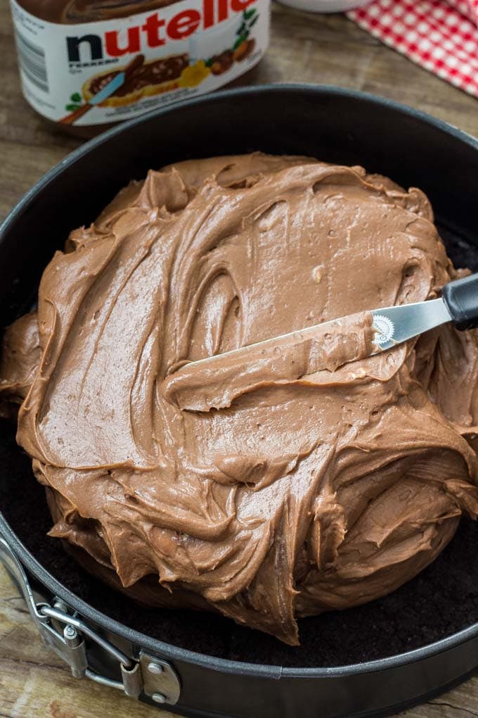No Bake Nutella Cheesecake is smooth, creamy and filled with Nutella. It's a decadent cheesecake recipe thanks to the chocolate cookie crust and rich Nutella flavor and it's so easy to make! No bake Nutella cheesecake with an Oreo crust