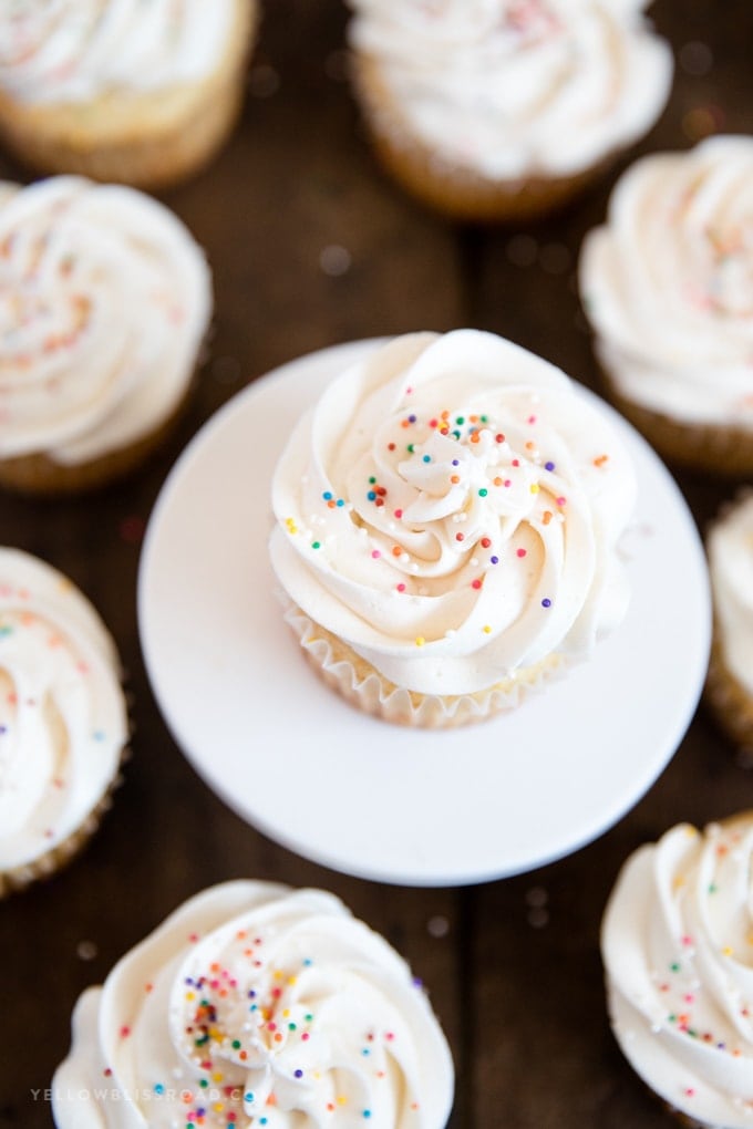 Easy Vanilla Cupcakes with Vanilla Buttercream | Dessert | Baking | Cake recipe overhead shot of cupcakes with white frosting and sprinlkes