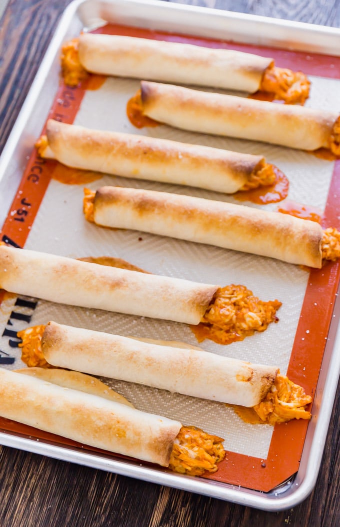 If Buffalo Chicken Dip and Chicken Taquitos had a baby, this would be it! And what a beautiful baby she is, with spicy shredded buffalo chicken wrapped in flour tortillas and baked to perfection- this is one snack that will be everyone's favorite!