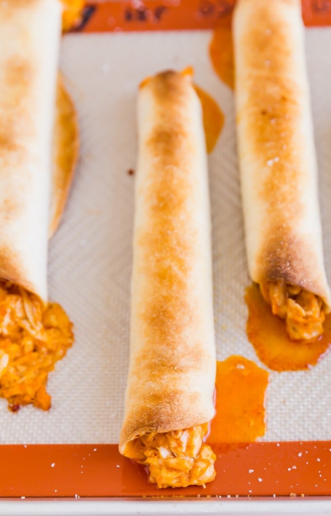 If Buffalo Chicken Dip and Chicken Taquitos had a baby, this would be it! And what a beautiful baby she is, with spicy shredded buffalo chicken wrapped in flour tortillas and baked to perfection- this is one snack that will be everyone's favorite!