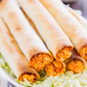 If Buffalo Chicken Dip and Chicken Taquitos had a baby, this would be it! And what a beautiful baby she is, with spicy shredded buffalo chicken wrapped in flour tortillas and baked to perfection- this is one snack that will be everyone's favorite!