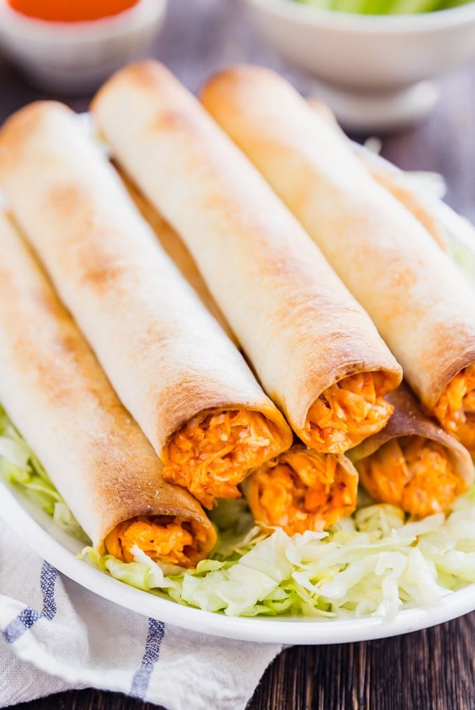 If Buffalo Chicken Dip and Chicken Taquitos had a baby, this would be it! And what a beautiful baby she is, with spicy shredded buffalo chicken wrapped in flour tortillas and baked to perfection- this is one snack that will be everyone's favorite!