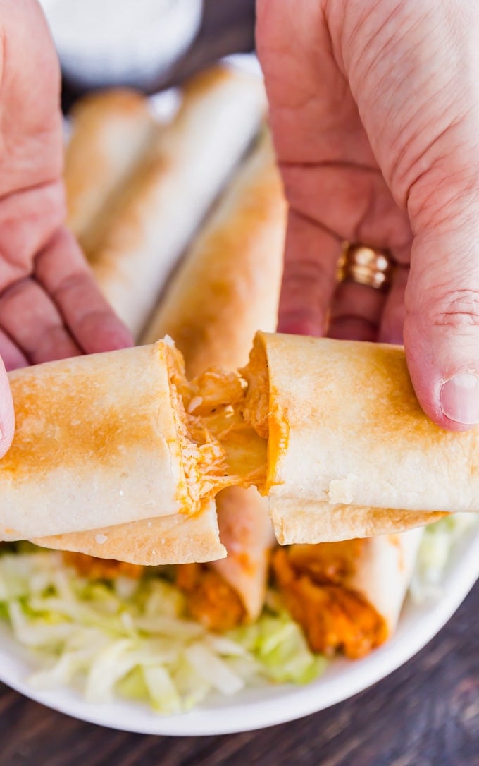 If Buffalo Chicken Dip and Chicken Taquitos had a baby, this would be it! And what a beautiful baby she is, with spicy shredded buffalo chicken wrapped in flour tortillas and baked to perfection- this is one snack that will be everyone's favorite!