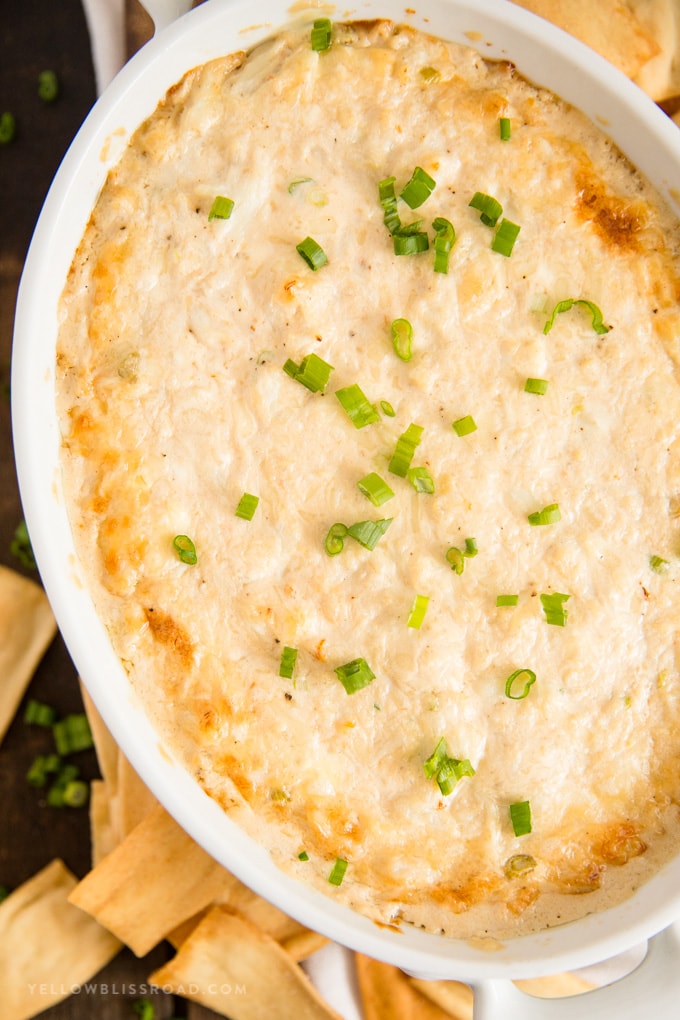 Cheesy Crab Dip baked in a white ceramic dish