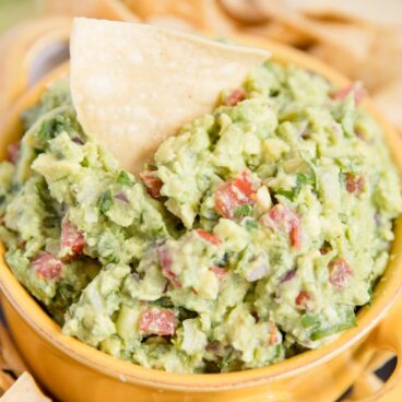 A close up of a yellow bowl of Guacamole