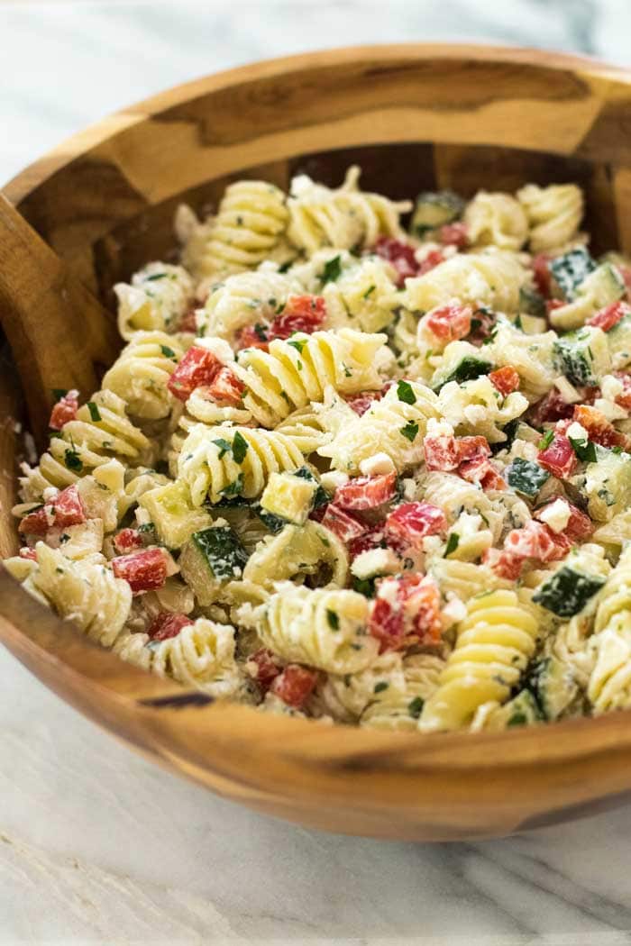 A bowl of food, with Salad and Pasta