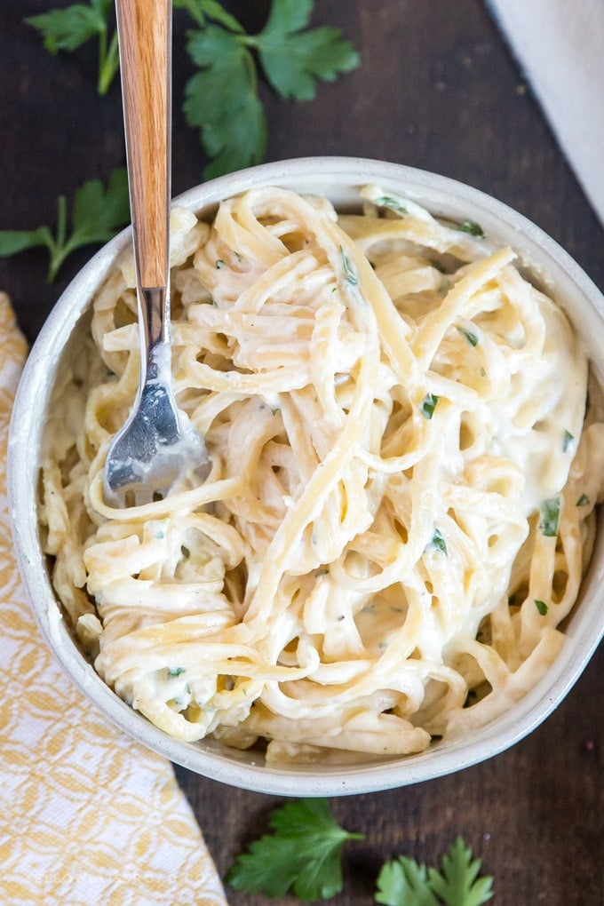 Fettuccine Alfredo in a bowl with a fork. 