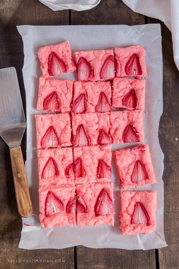 Strawberry Brownies are a super simple springtime dessert that comes together easily with just a few pantry ingredients and some fresh strawberries. recipe for strawberry brownies made from cake mix