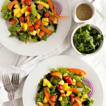 overhead photo of two black bean and mango salads