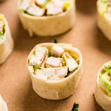 Chicken Caesar Salad Pinwheels make a light and delicious lunch or and super tasty appetizer! They're also an excellent way to use leftover chicken!