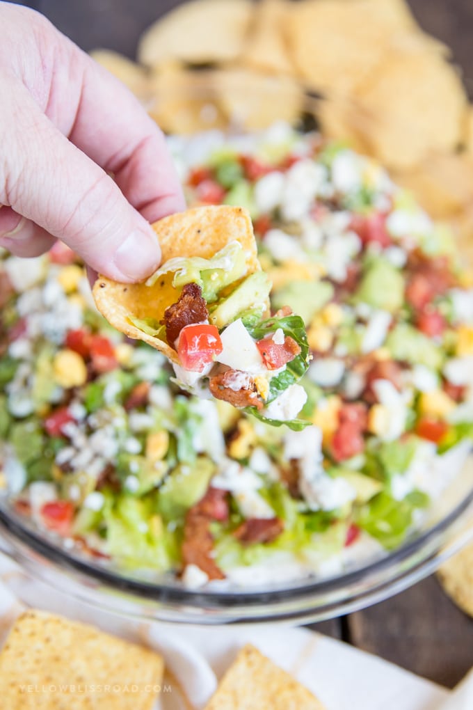 cobb salad dip on a tortilla chip