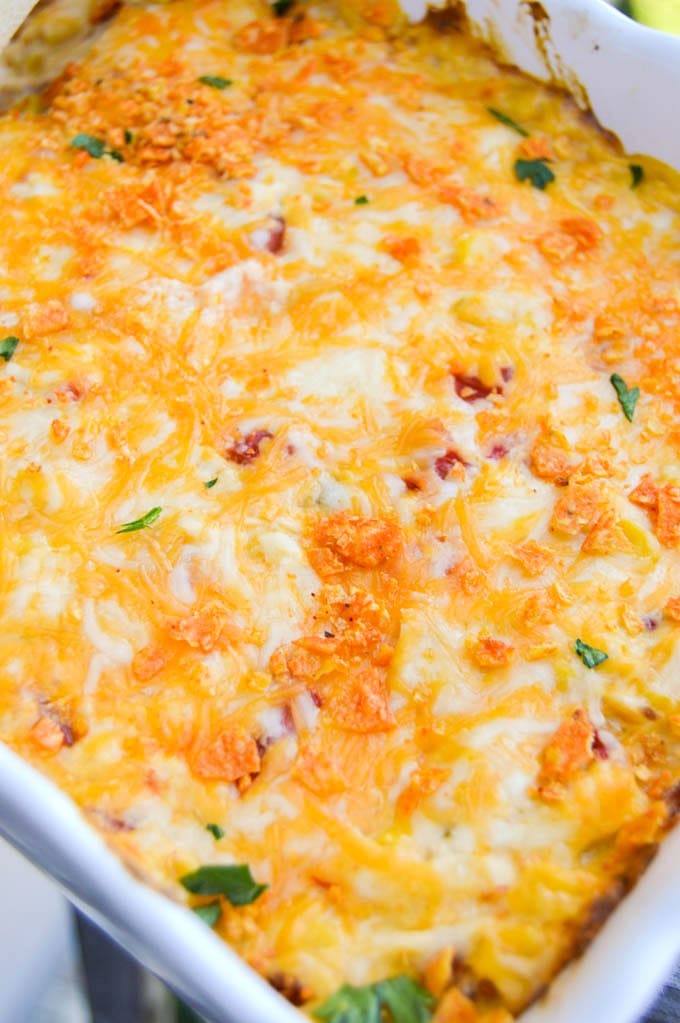 Dorito Chicken Casserole topped with melted cheese