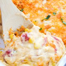 Serving spoon with a scoop of Dorito Chicken Casserole for plating