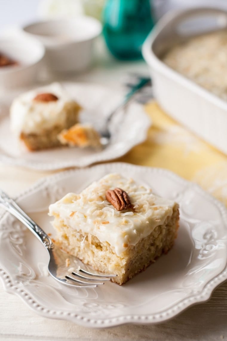 Don't let those ripe bananas go to waste! Whip up this tender, fluffy Banana Cake with Pineapple Cream Cheese Frosting and bring a little taste of the tropics to your summer party!