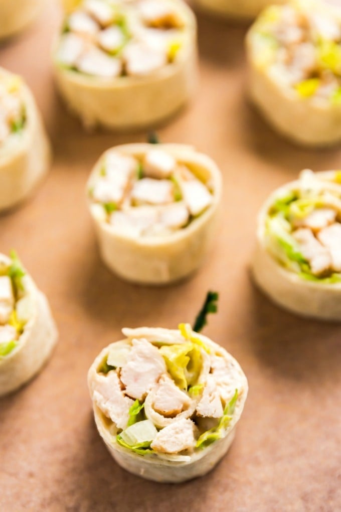 Chicken Caesar Salad Pinwheels make a light and delicious lunch or and super tasty appetizer! They're also an excellent way to use leftover chicken!