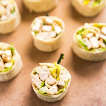 Chicken Caesar Salad pinwheels on a plate