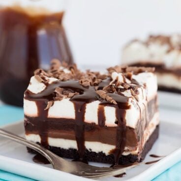 Slice of chocolate lasagna with chocolate syrup