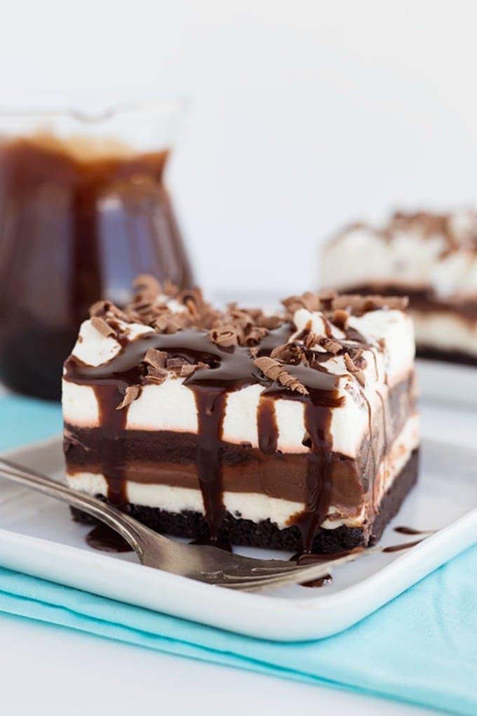 Slice of chocolate lasagna with chocolate syrup