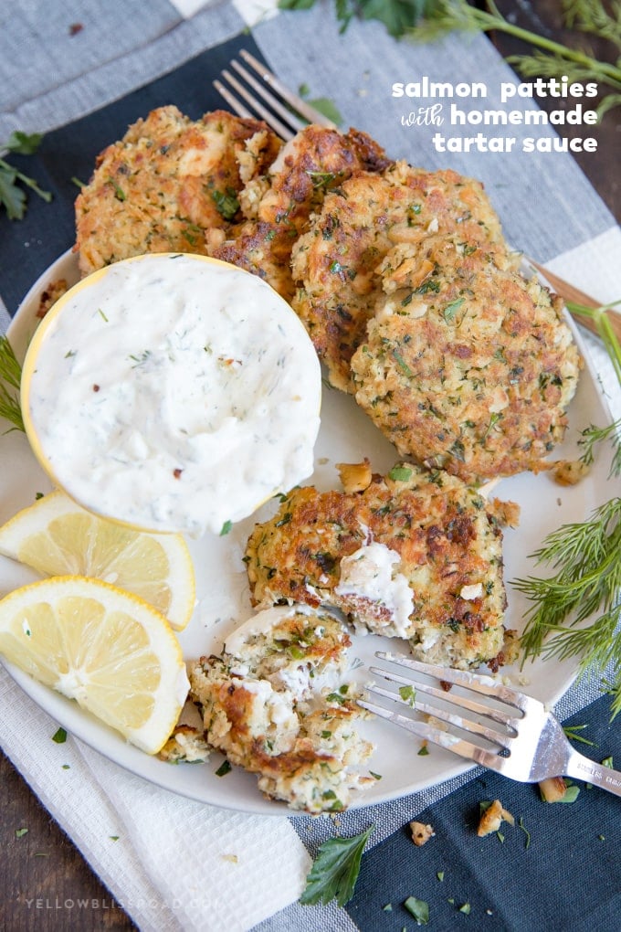 salmon patties on a plate with homemade tartar sauce and lemon wedges | salmon patty recipe | salmon cakes