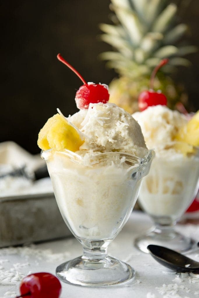 Cool, refreshing, and dairy free, this no-churn Pina Colada Ice Cream is a cocktail favorite turned frozen treat that's made with only FOUR ingredients! Pina Colada Ice Cream