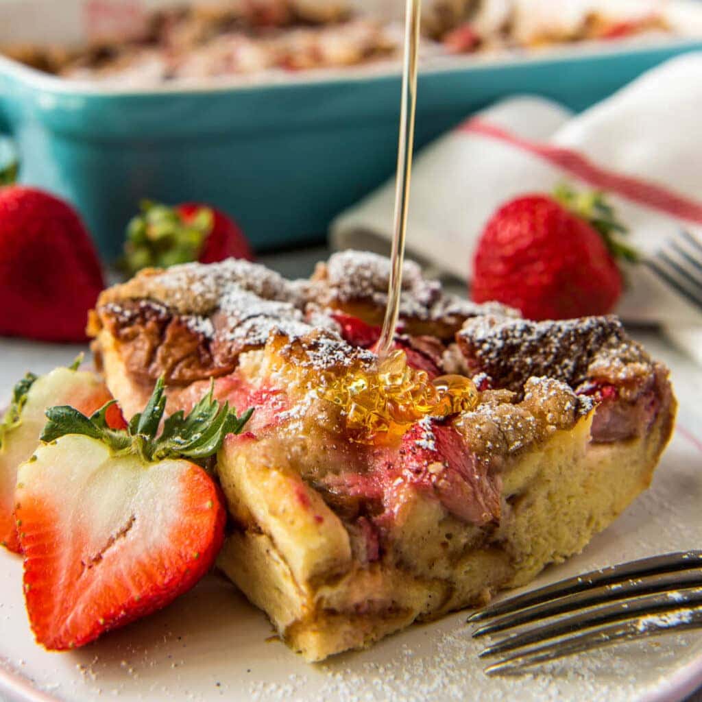a square image of strawberry baked french toast for social media