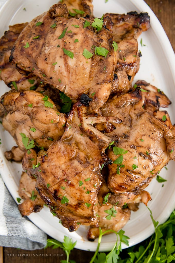 A great grilled chicken marinade is essential for summer grilling. This delicious marinade packs a flavor punch and is perfect for all kinds of chicken! grilled chicken on a plate