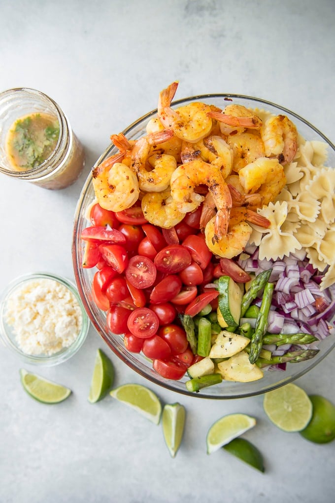 ingredients for Grilled Shrimp Pasta Salad in a serving bowl 