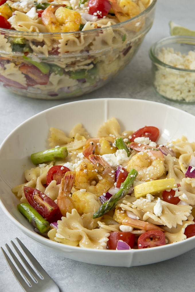 Grilled Shrimp Pasta Salad is a bowl with a fork