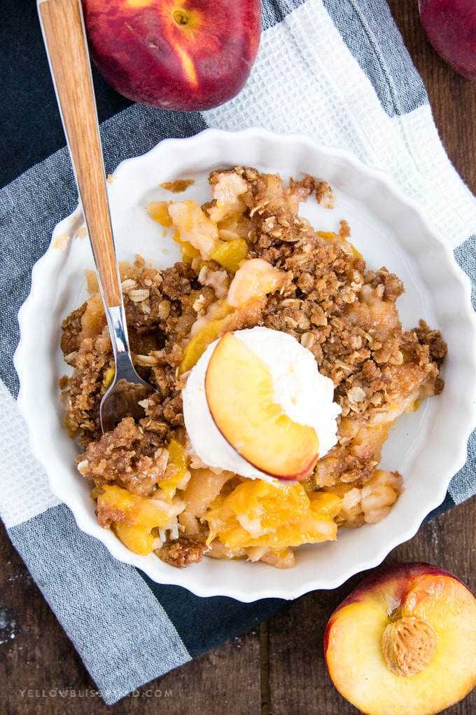 A plate of Peach Crisp with ice cream