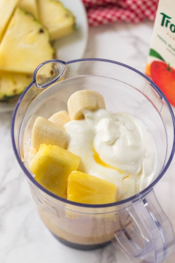 pineapple smoothie ingredients in a blender