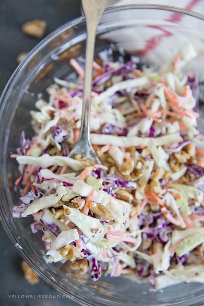 A spoonful of Creamy Coleslaw with Walnuts