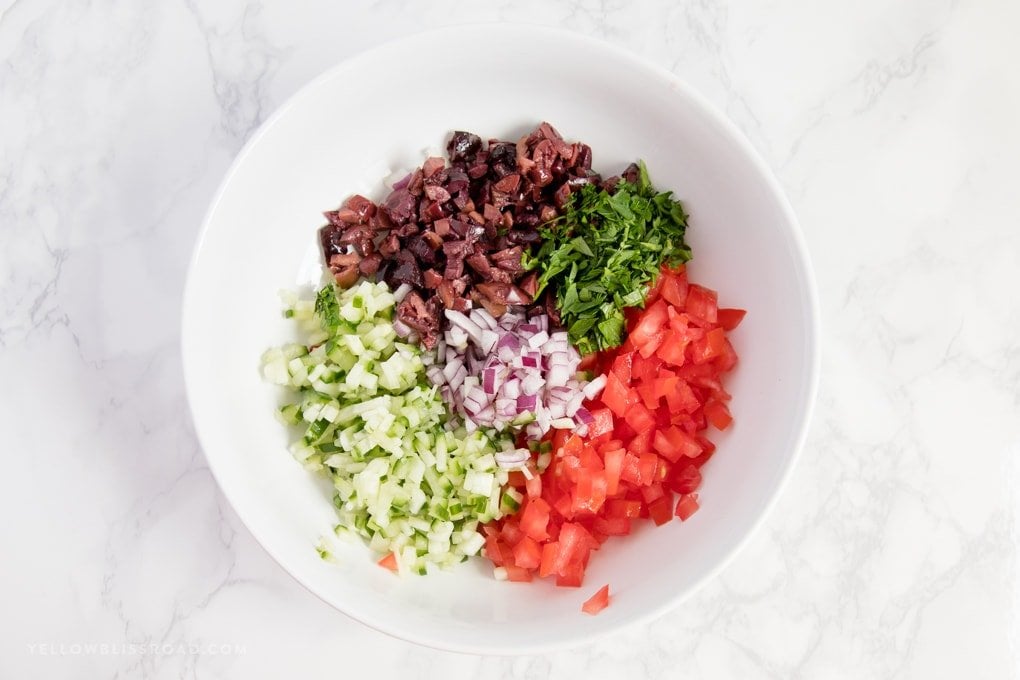 Ingredients needed to make Greek Salad Pinwheels.