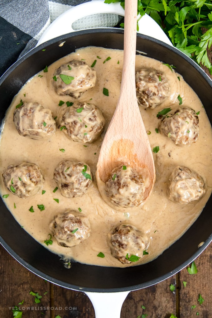 swedish meatballs in a large skillet with sour cream gravy 