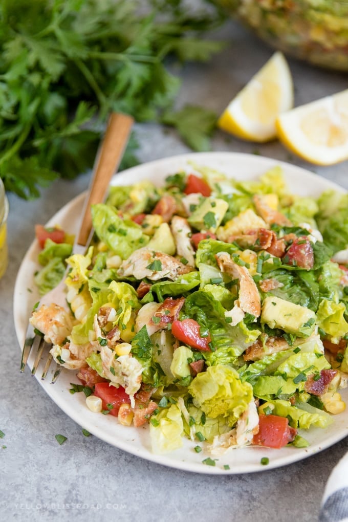 This Bacon Avocado Chicken Salad has veggies, bacon, avocado and a healthy lemon dressing, making this recipe completely guilt free!