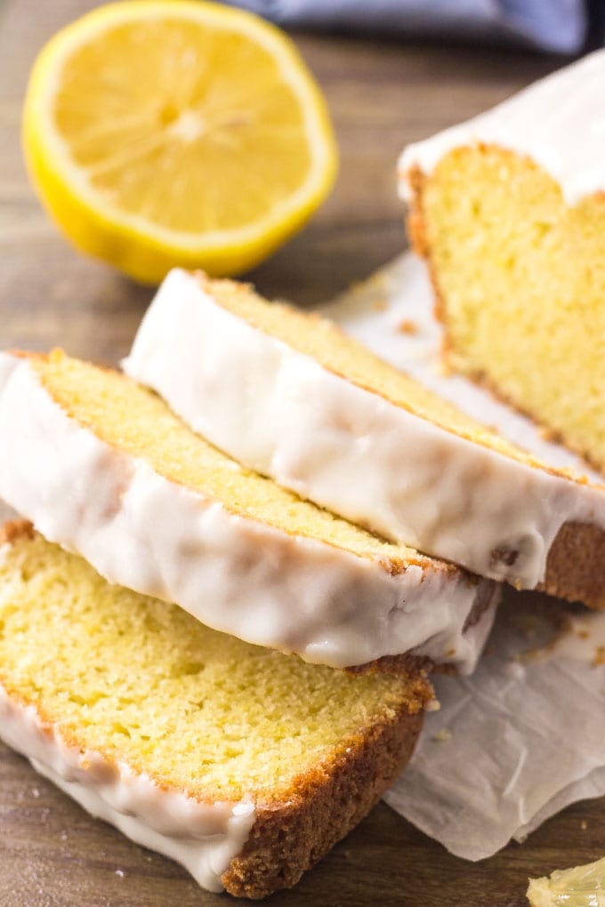 A freshly cut Starbucks lemon loaf with sweet lemon icing. 