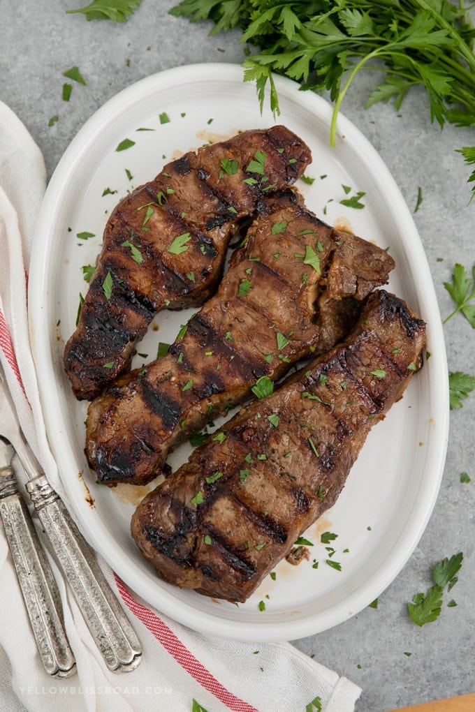 3 grilled New York Strip Steaks in a delicious steak marinade
