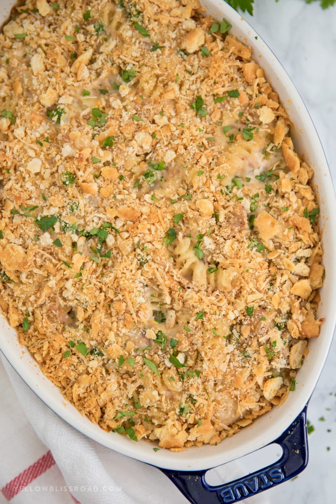 My Tuna Casserole Recipe is pure, classic comfort food for a weeknight dinner. Tuna, noodles and peas in a cheesy homemade sauce with a crunchy cracker crumb topping. Tuna Casserole with a Crunchy Cracker Crumb Topping