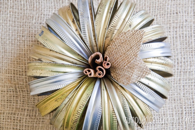 A close up of canning jar ring pumpkin