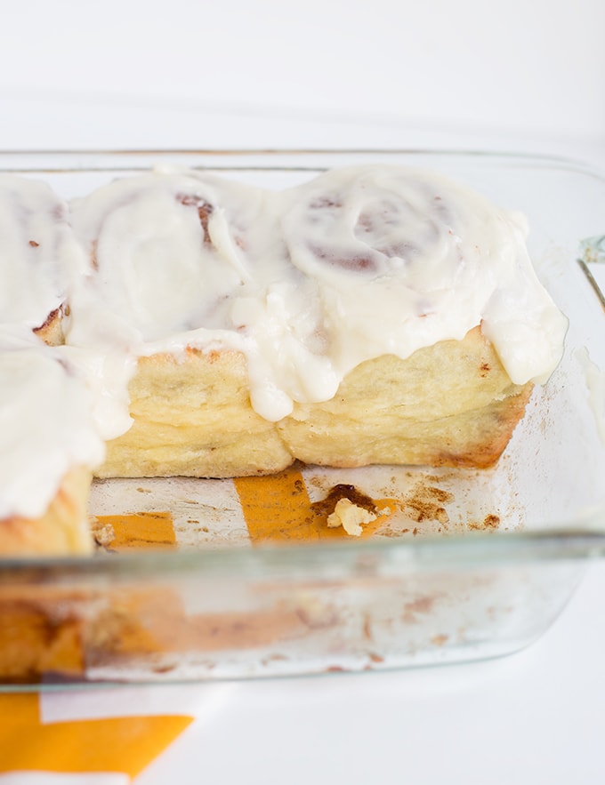 pan of homemade cinnamon rolls with a few taken out