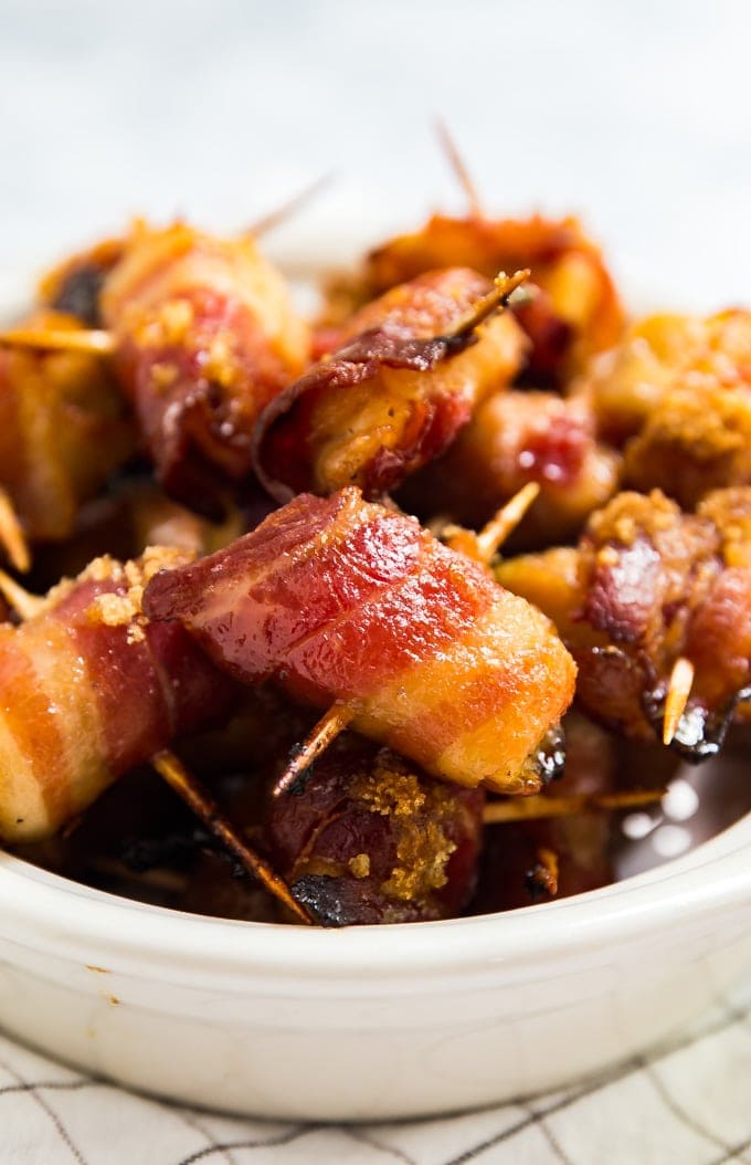 Bacon Wrapped Chicken Bites piled up in a serving bowl